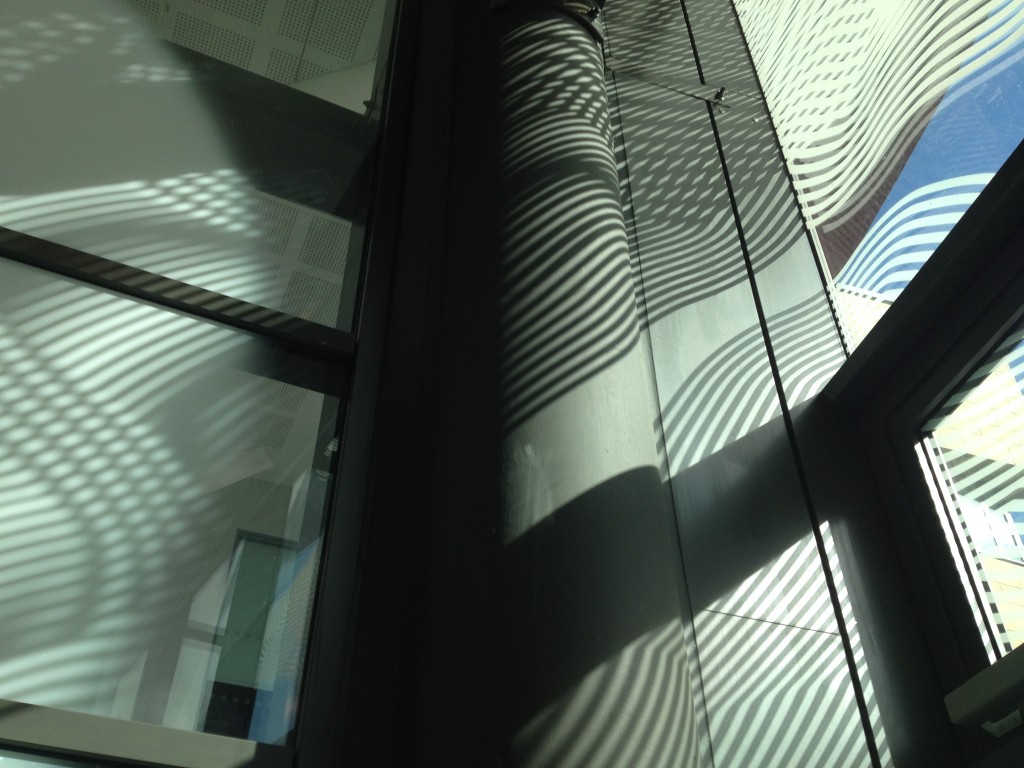 This image shows the shadows cast by the glazing manifestation artwork applied to the interior glazed lobby. Sheffield Hallam University, Heart of the Campus. Image: Christopher Tipping