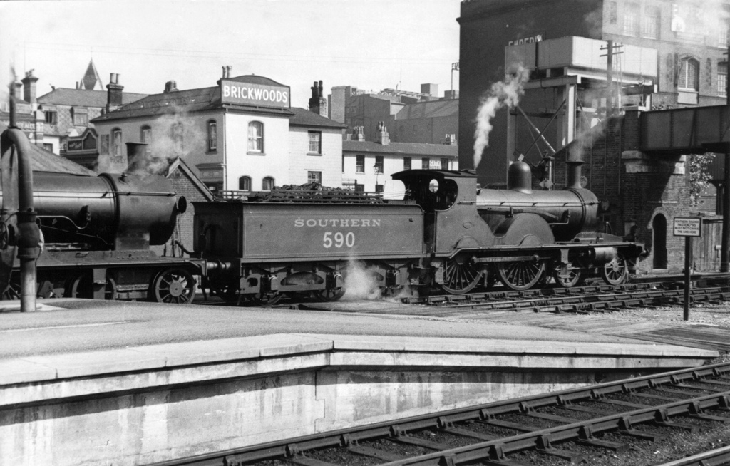 Steam train passing through from 1936. The spire of St Peters Church is just visible on the left & the footbridge, still in use today to cross the tracks is on the far right. Image: Bert Moody Collection