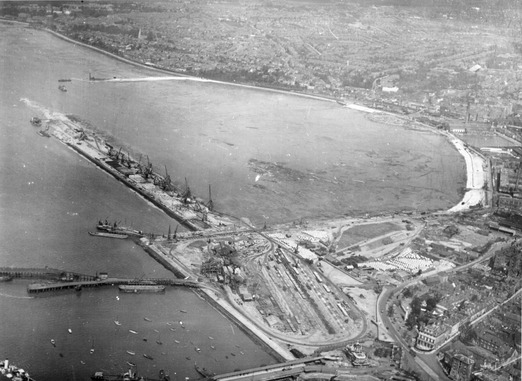 This aerial view across West Bay looking towards Millbrook & Southampton Station, shows the extent of the reclamation works underway during the construction & expansion of the Western Docks in 1929. Image: Dave Marden Collection - Associated British Ports 