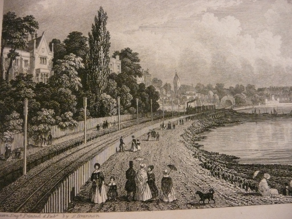 A view east towards the city with St Peters Church in the background. This drawing by Philip Brannon shows the shoreline around Blechynden at some point soon after the coming of the railway in 1847. The image was accompanied by the words..."a stroll along the beach was enhanced by a glimpse of a steam engine, where the line passed close to the shore". St Peters Church on Commercial Rd was completed in 1842. Image by permission of Southampton City Council Local Studies and Maritime Collection.