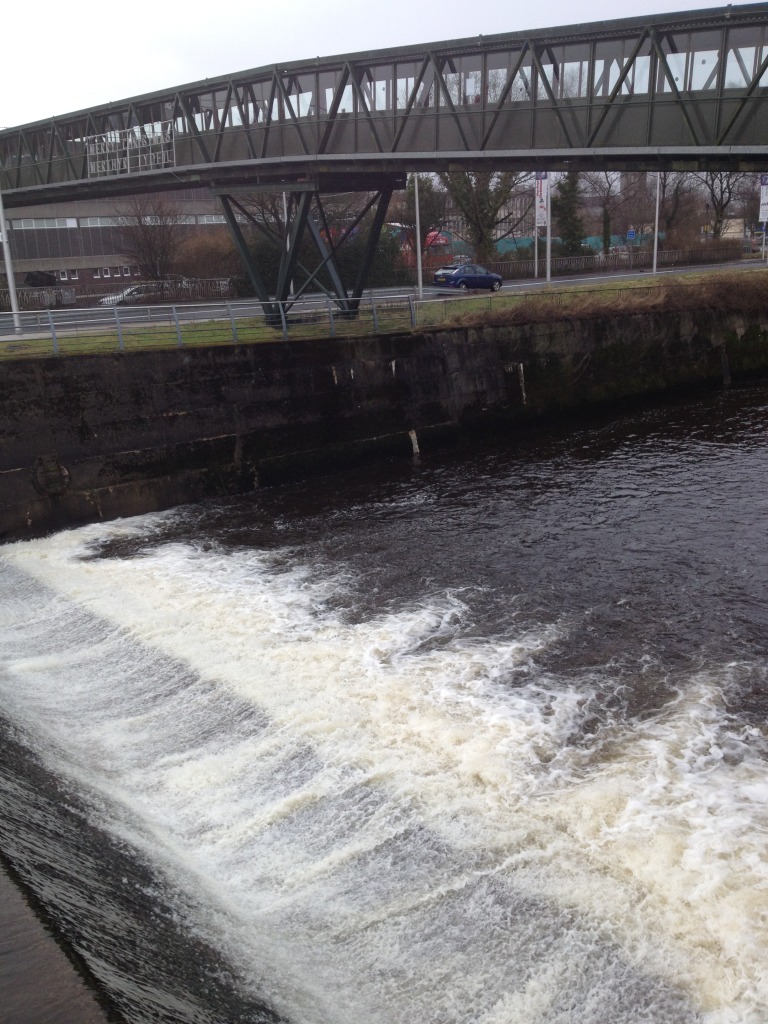 The River Taff footbridge crosses just below the weir from the College to St Tydfils Shopping Centre. Image: Christopher Tipping