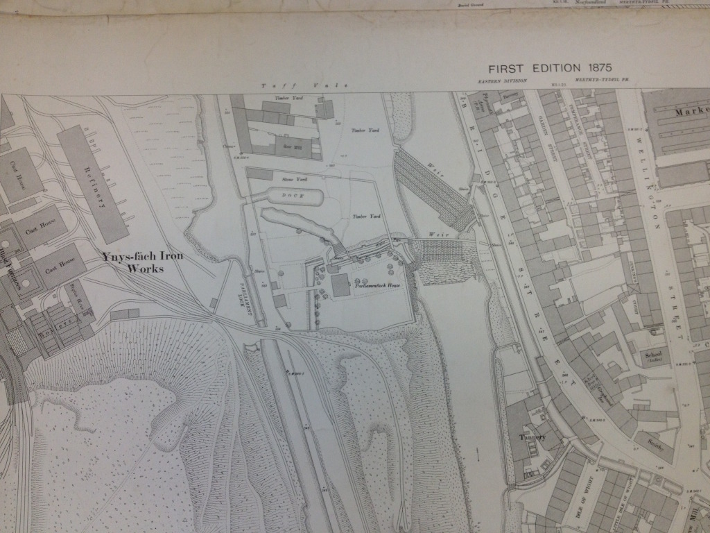 Detail of OS Public Health Map of 1875 - showing the weirs crossing the Taff. The Glamorganshire Canal can be seen to the left. Reproduced from the 1875 Ordnance Survey Map. Collection of Merthyr Tydfil CBC Libraries. 