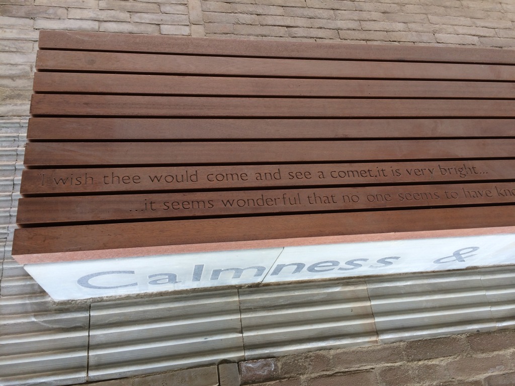 Central Chelmsford for Genesis Housing Association. Detail: Yorkstone steps with inset granite text & timber seating routed with more text as part of the embedded public art interpretation. The image was taken during installation on site. Image: Christopher Tipping