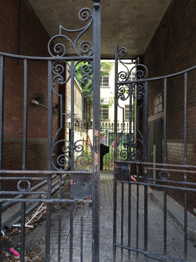 Wrought iron gates remain intact at the courtyard entrance to the old Post Office Building on lower Railway Street, Chatham. The building is a handsome addition to the fabric of the street, but is currently empty. Image:Christopher Tipping