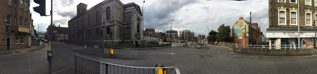The junction of Waterfront Way with the A2 at St John's Church, Chatham, where the highway has been punched through Railway Street, creates a hostile zone for pedestrians and effectively cuts off the lower part of Railway Street and the Town Centre, from the upper section and the Railway Station. Image:Christopher Tipping