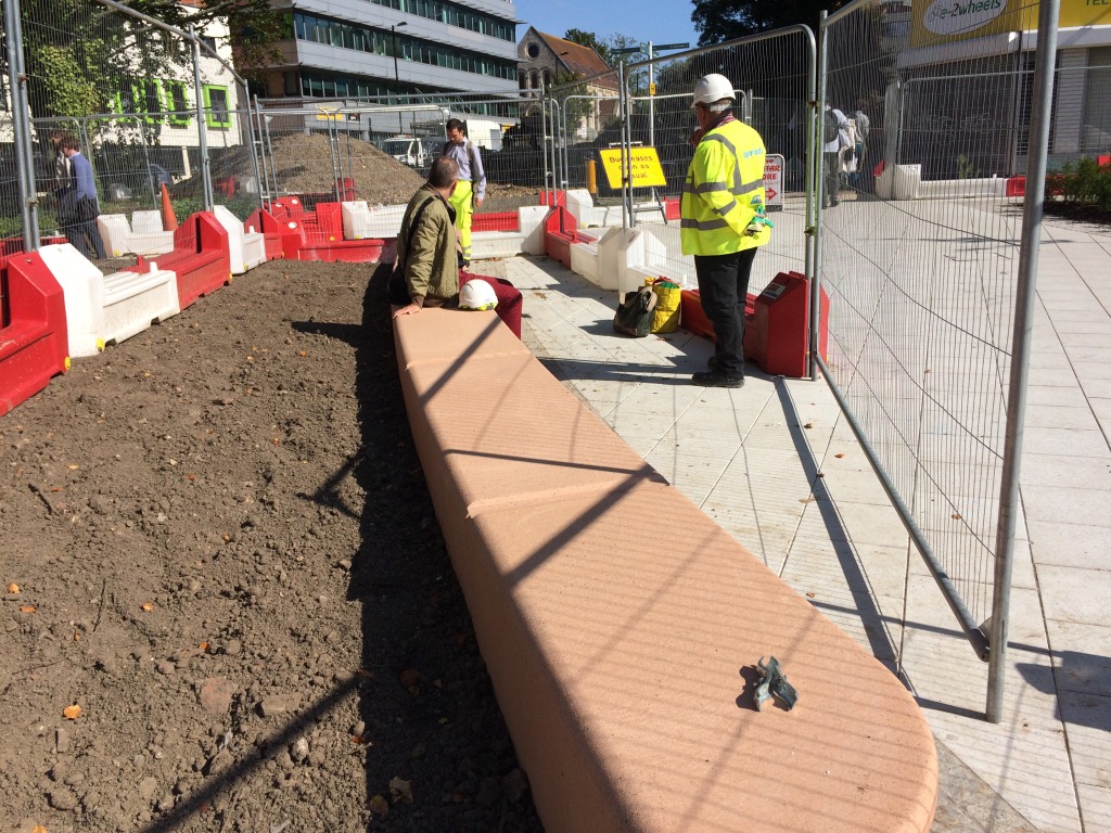 Station Quarter North, Southampton. Bespoke four piece cast concrete radius bench during final installation on Commercial Road. Image:Christopher Tipping
