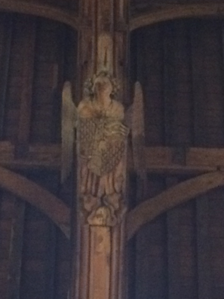 A carved angel - part of the massive hammer beam roof of Westminster Hall, Monday 13th June 2016